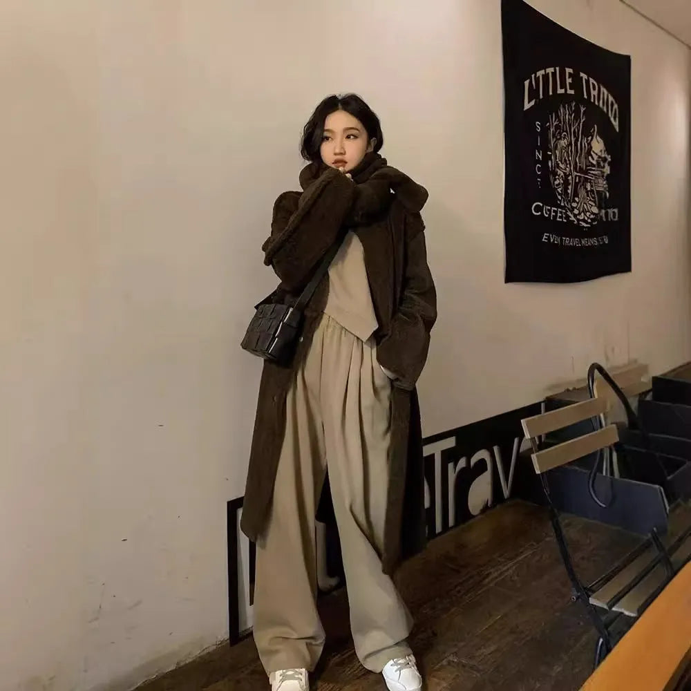 Women's khaki loose-fit casual sportswear set with long sleeve top and trousers on a hanger.