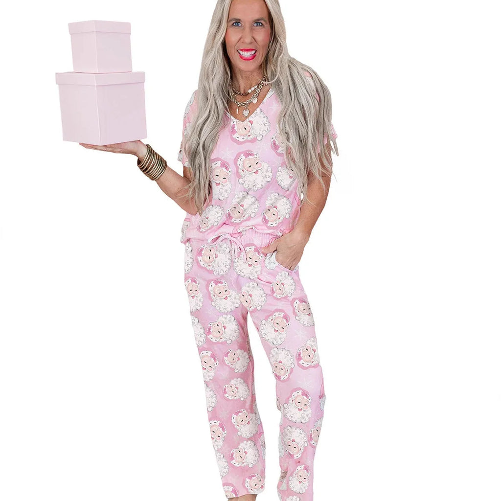 Women's pink Christmas print top and trousers set, short sleeve top, full length trousers, polyester, sizes S-XL.