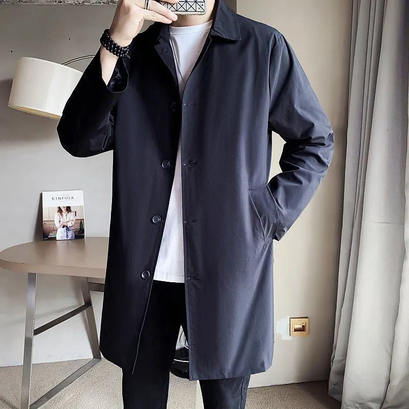 Man wearing a mid-length khaki loose-fit casual trench coat made of rabbit fur.