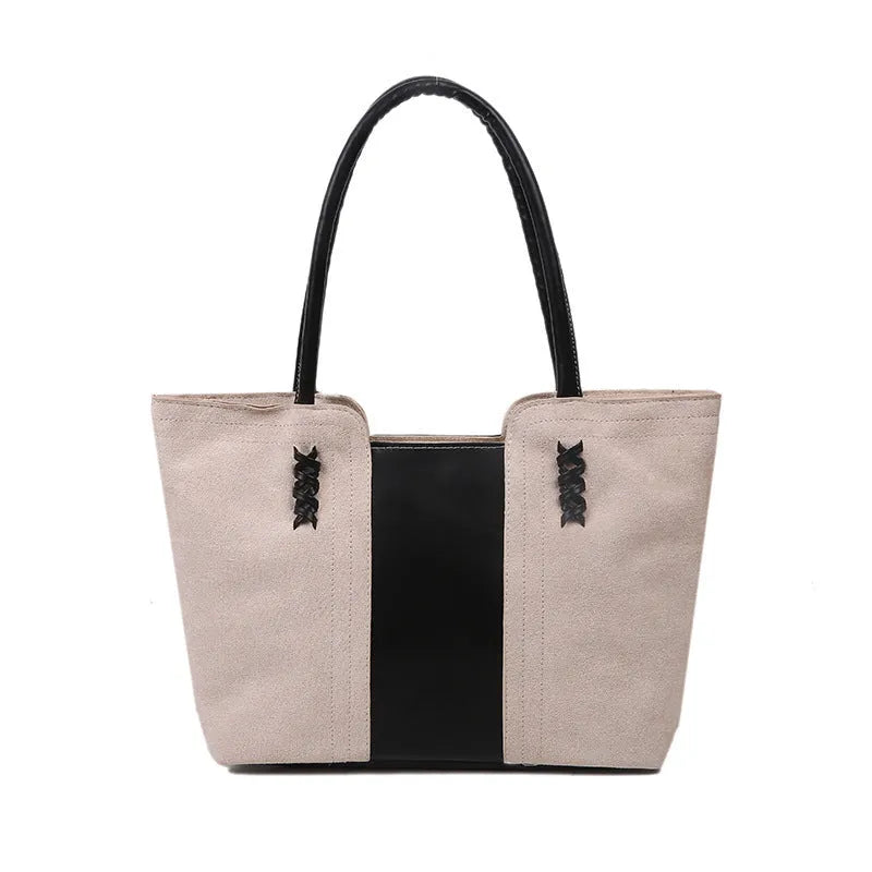 Women's large nylon tote bag in black with detachable shoulder strap, polyester lining, phone and document pockets