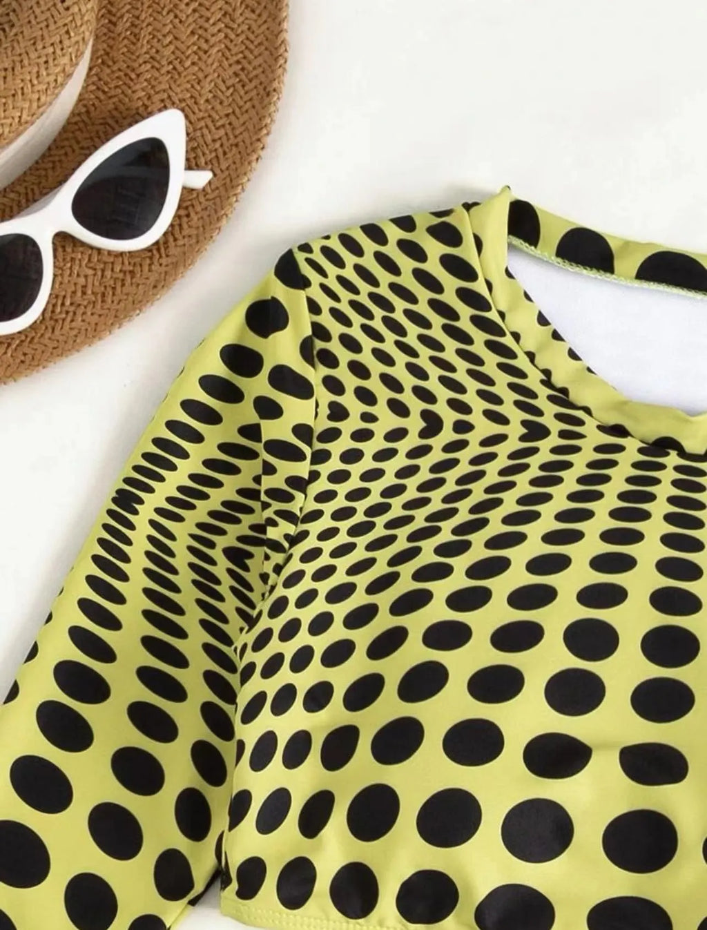Women's green polka dot swimsuit three-piece set showing top, skirt, and bra