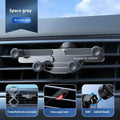 Universal anti-shake alloy car gravity bracket for air outlet, shown in black, grey, or silver