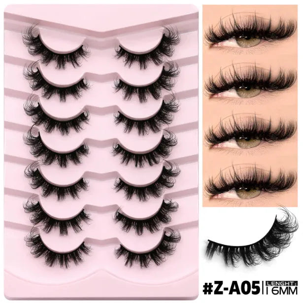 Box of artificial fibre false eyelashes in a natural long thick style with a tube of adhesive glue