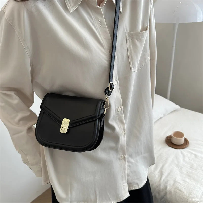 Soft PU leather shoulder messenger bag with clamshell opening in khaki colour, shown from the front.