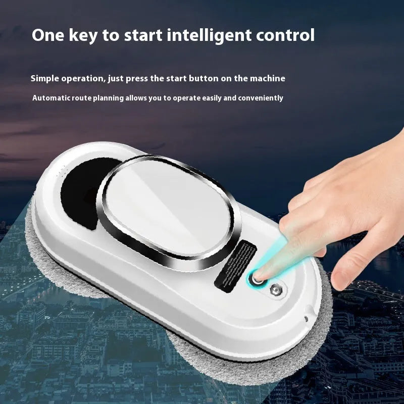 White automatic high altitude window cleaning machine with remote control and cleaning accessories on a surface.