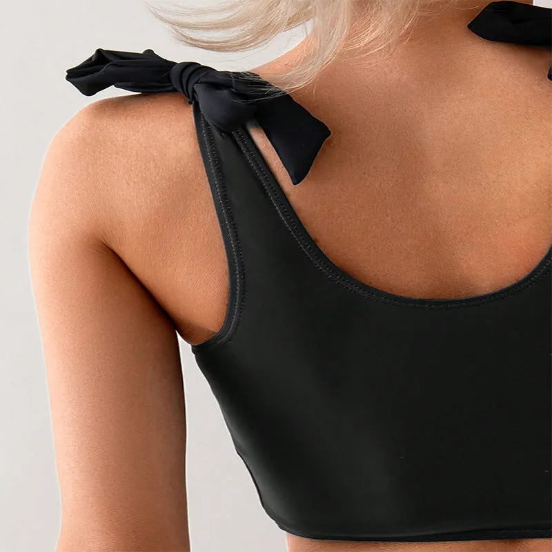 Women's coconut print bikini swimsuit with lace-up front on the top.