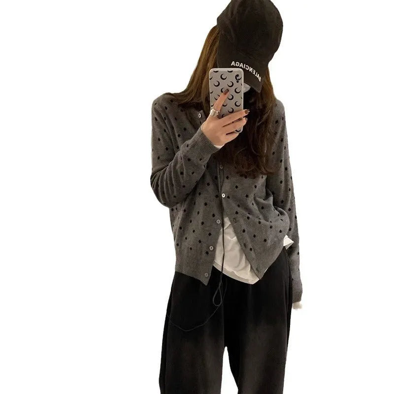 Women's grey dot knitted cardigan with crocheted flower detailing and long sleeves