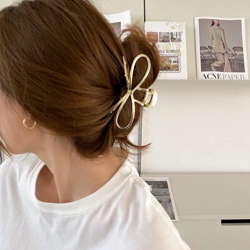 Women's Korean style bow hair barrette with alloy construction in silver or gold colour option