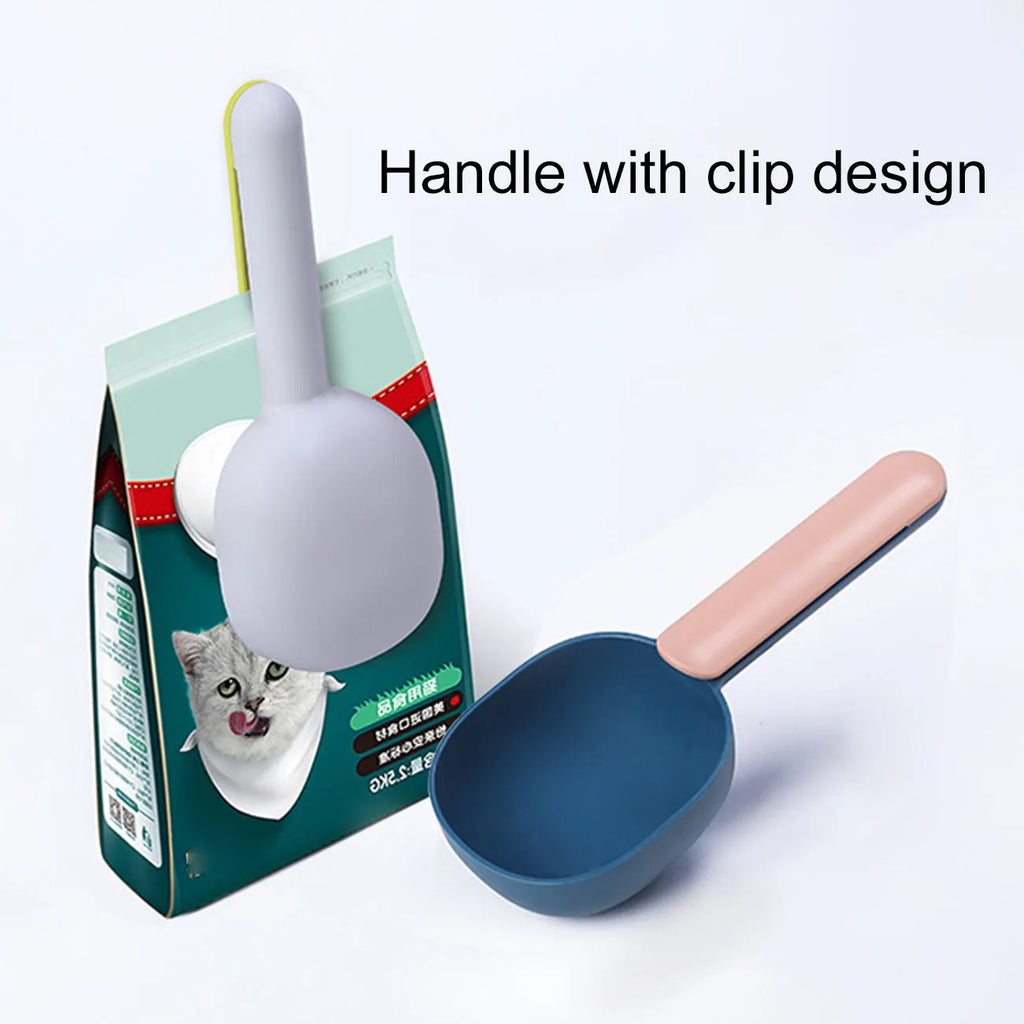 Blue plastic pet food scoop with 1 cup measure and bag clip handle on white background