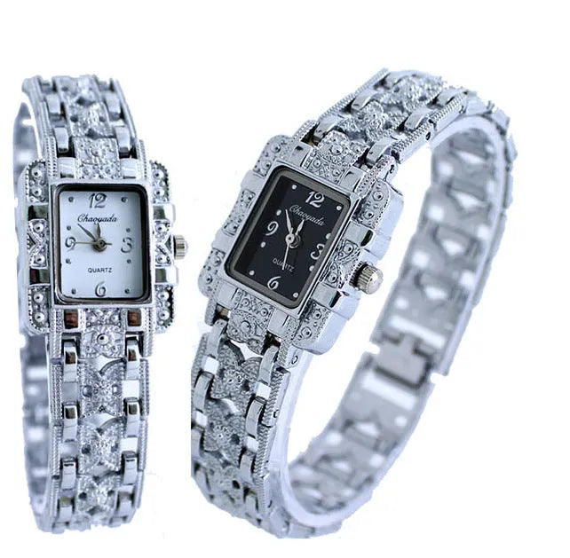 Women's square bracelet watch with black dial surface on display in OPP packaging