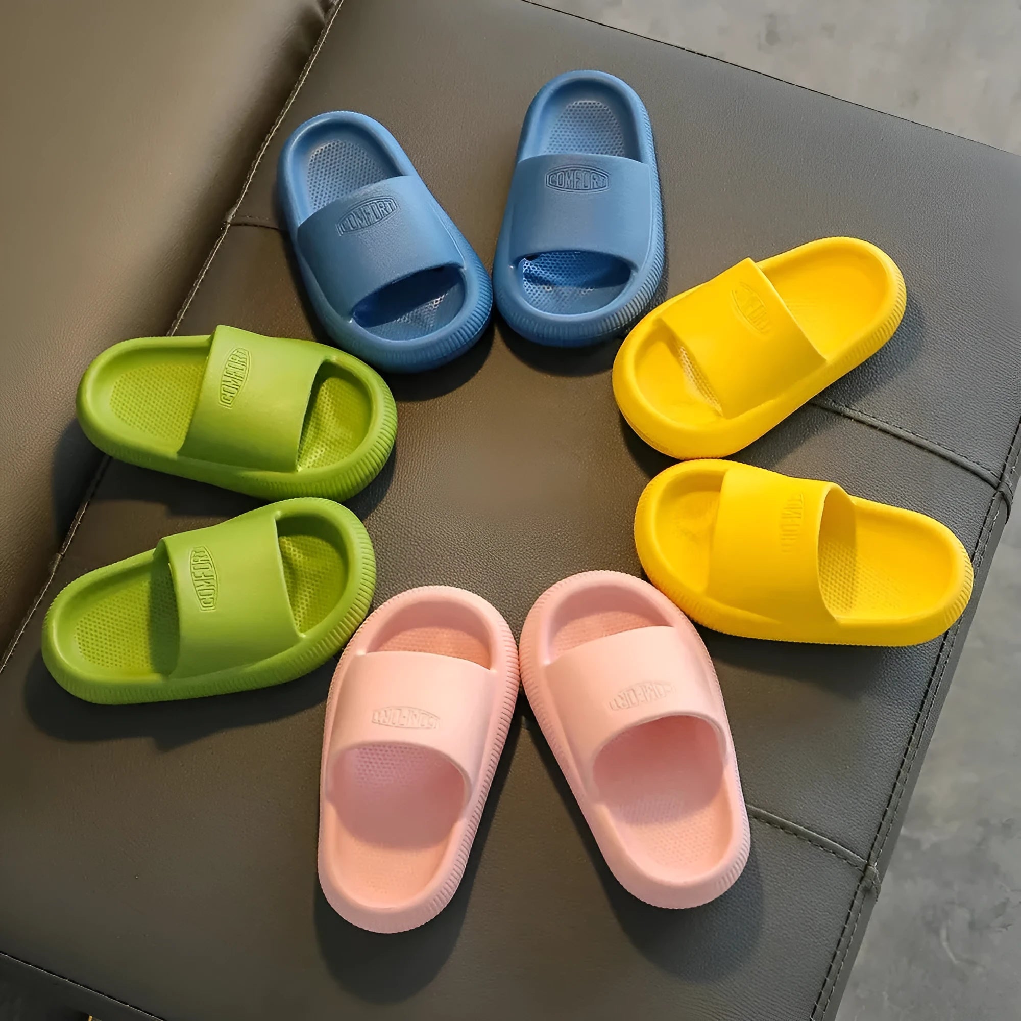 Colourful children's EVA slippers with a non-slip sole, shown in mixed colours on a white background.
