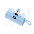Capsule digital display wireless pocket power bank showing five colour options with integrated plug