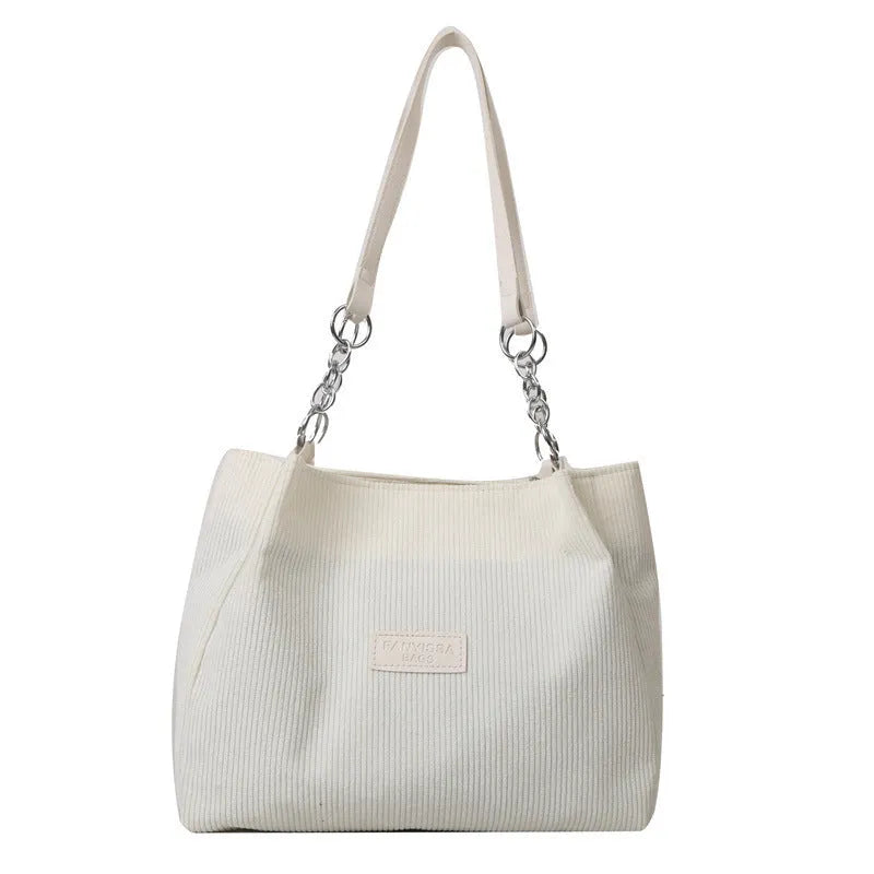 Corduroy one-shoulder tote bag in horizontal square shape with three-dimensional pocket
