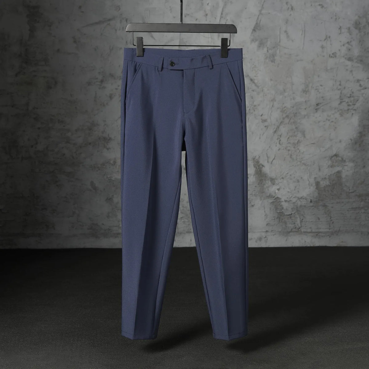 Men's straight loose trousers in light gray brushed polyester, front view showing straight cut and elastic waist