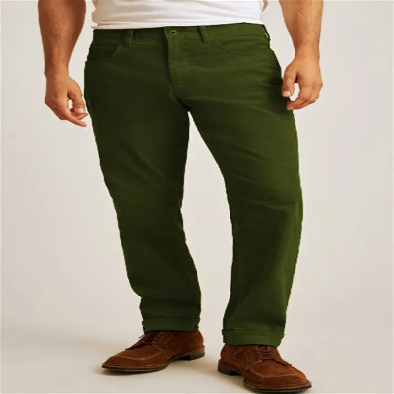 Loose fit solid colour corduroy casual trousers on a hanger showing straight leg and mid waist.
