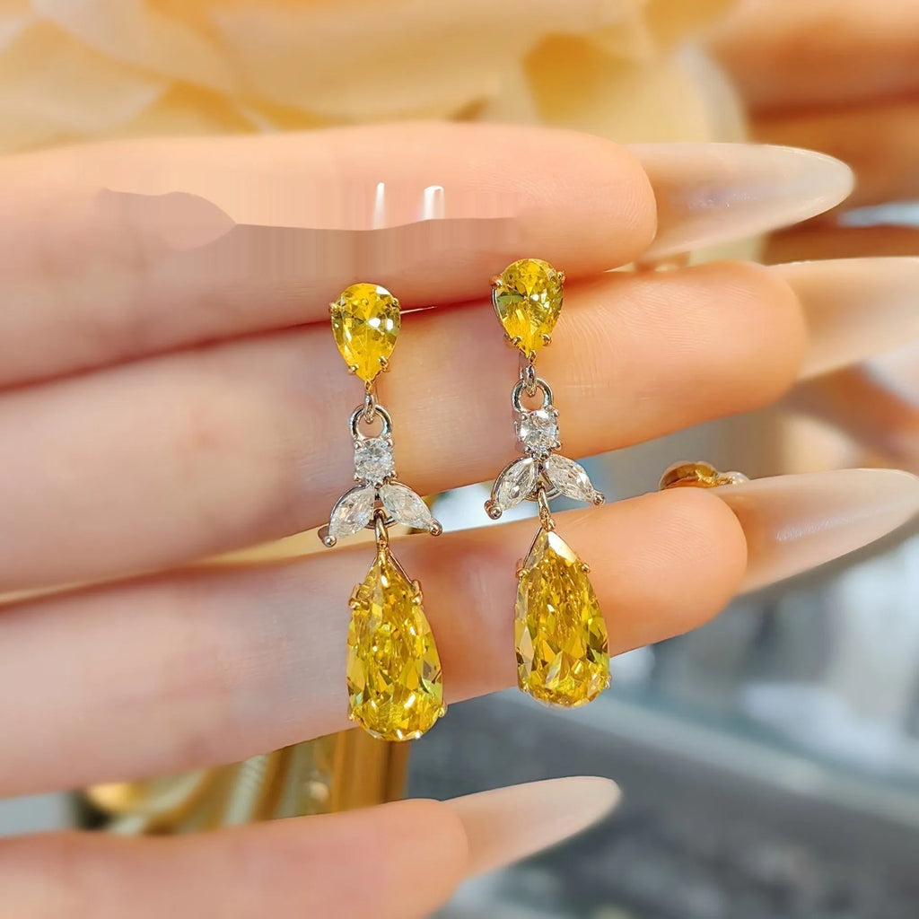 Pair of floral earrings in pink or yellow diamond finish with copper base and retro petal design