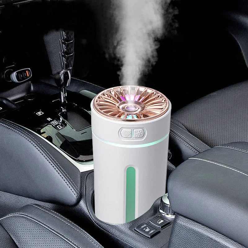 Black and white portable wireless humidifier with LED lights on a car cup holder and desktop