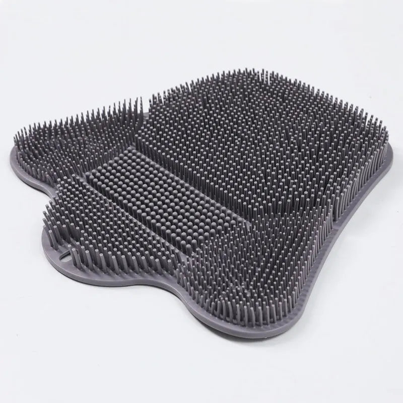 Blue silicone bath massage cushion mat with textured surface for handheld scrubbing.
