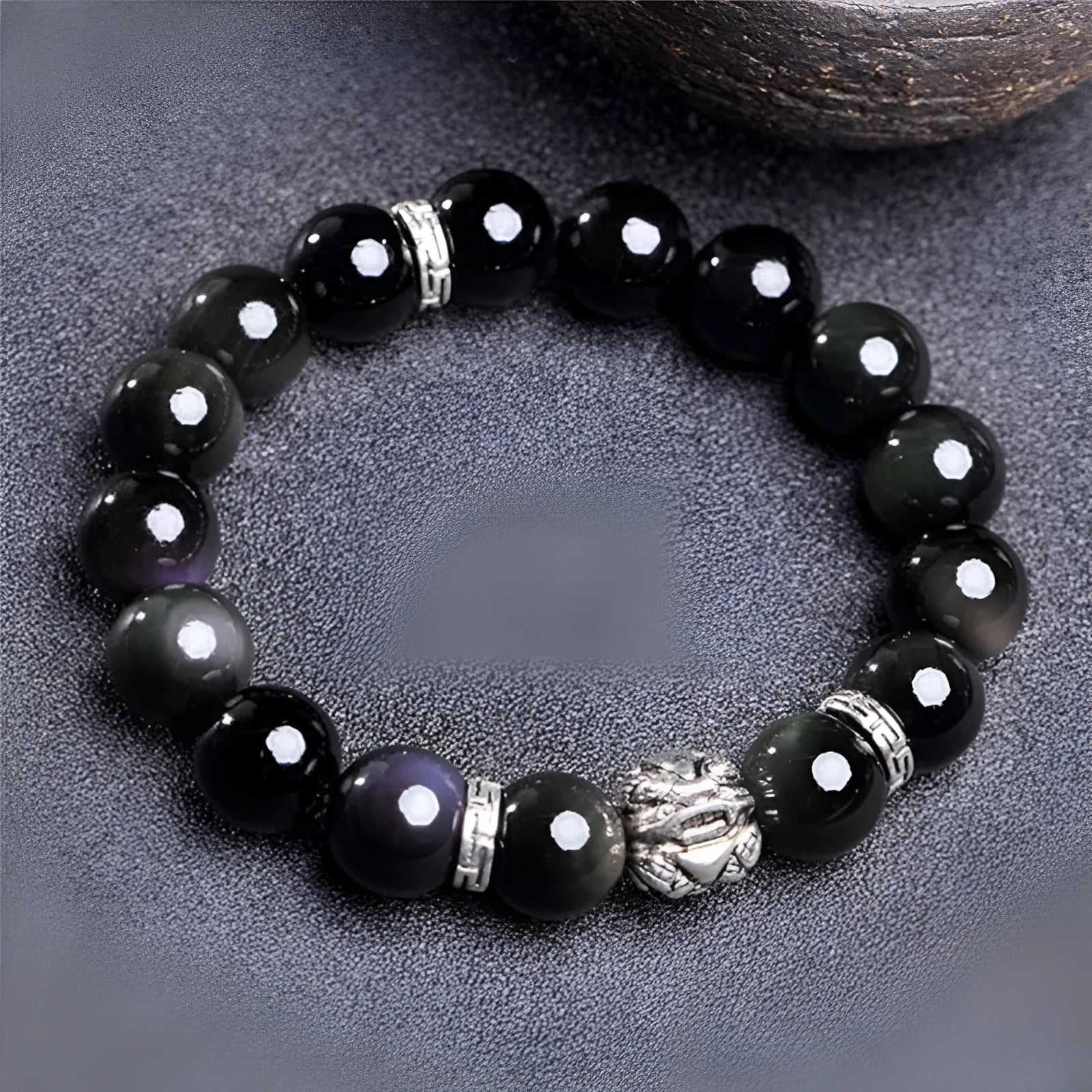 Obsidian and 999 silver beaded bracelet showing Jucai NAFU stone detail in two size options.
