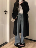 Women's 65cm knitted cardigan with V-neck and long sleeves in polyester fabric