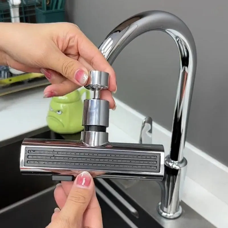 Black ABS kitchen faucet extension with rotating bubbler and waterfall outlet mode on a modern sink