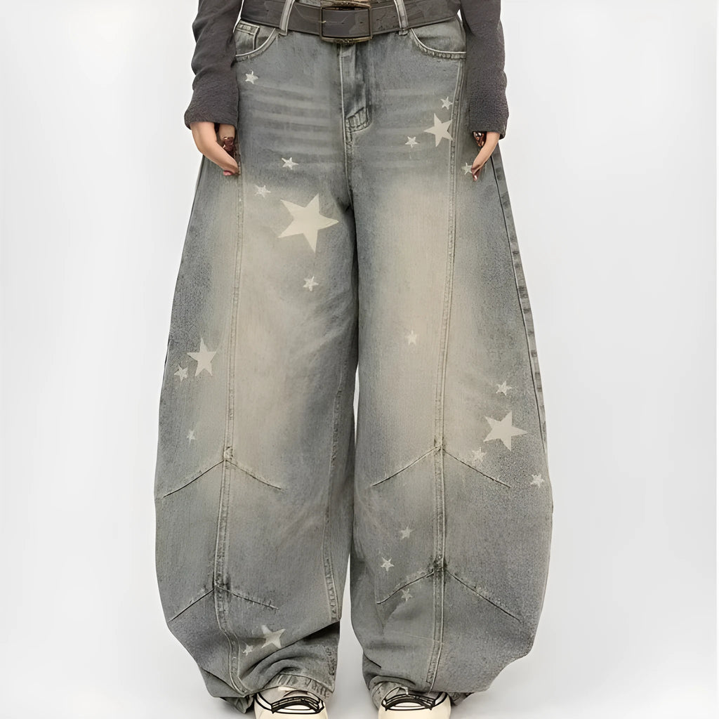Men's blue loose fit jeans with vintage washed, distressed and grey splatter finish, mid-rise waist and long pant length.