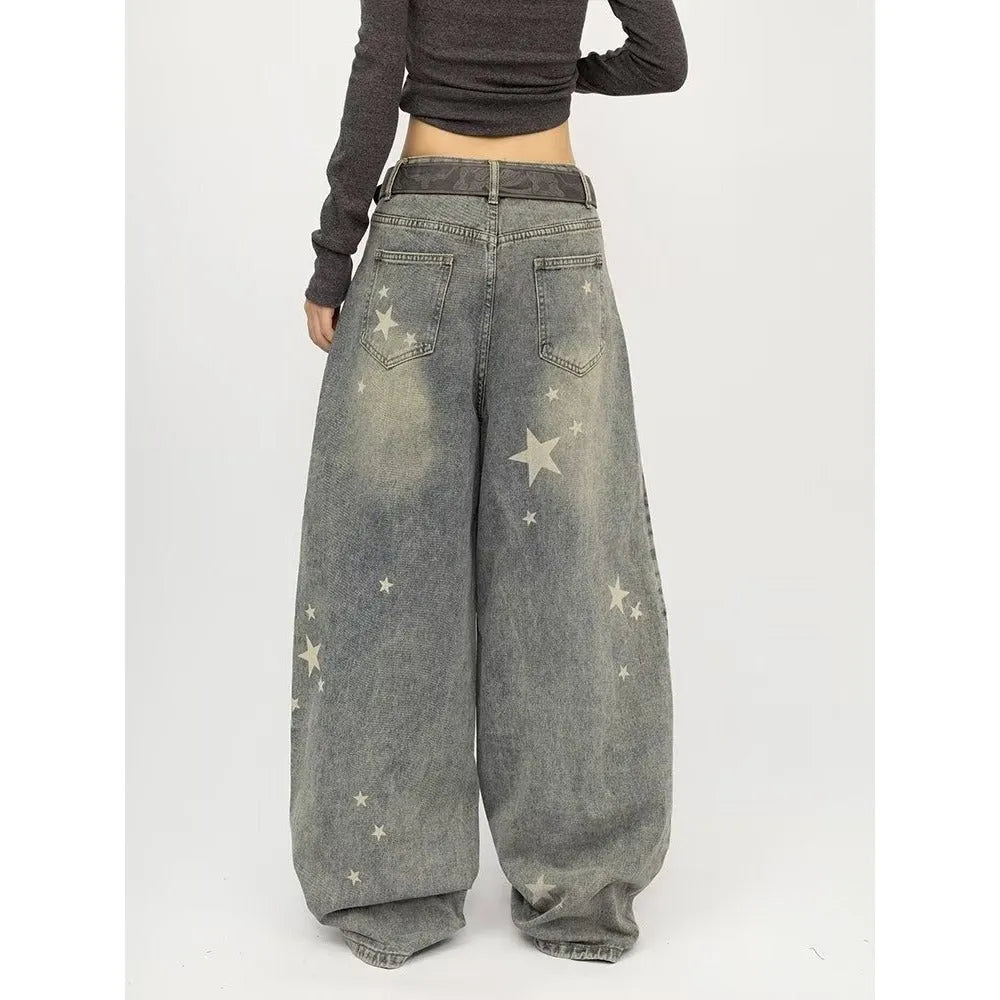 Men's blue loose fit jeans with vintage washed, distressed and grey splatter finish, mid-rise waist and long pant length.