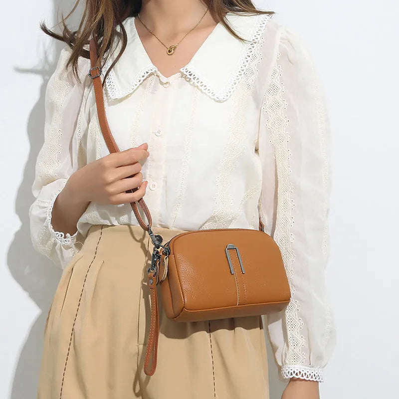 Genuine leather women's shoulder bag in horizontal square shape showing black, navy, green, brown colour options