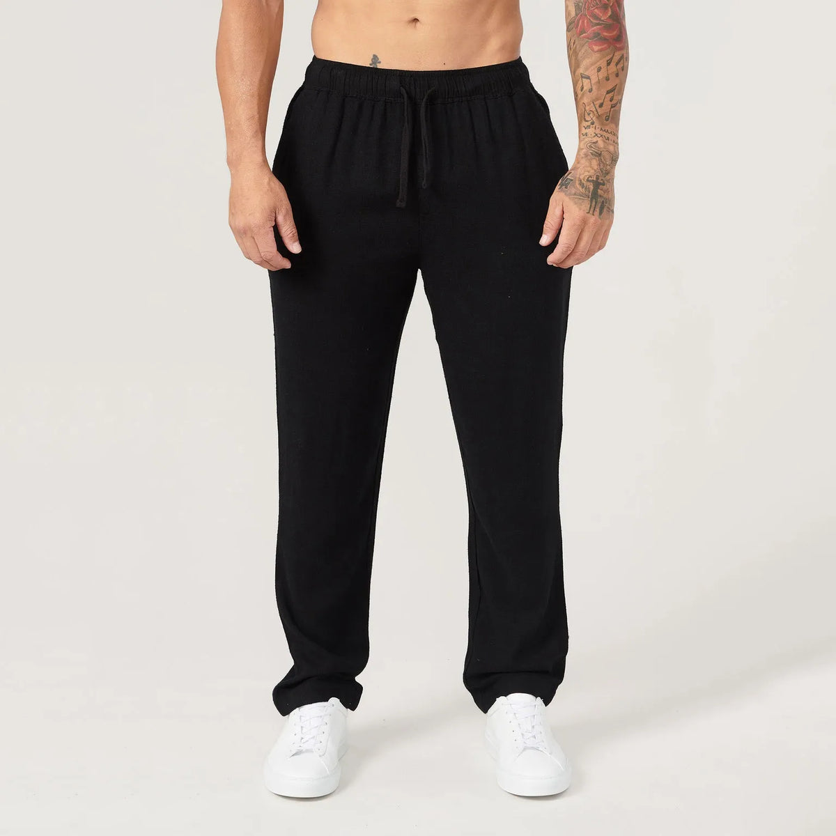Men's casual sports trousers in polyester, available in white, black, khaki and sky blue, sizes S to XXL, no liner, regular length.
