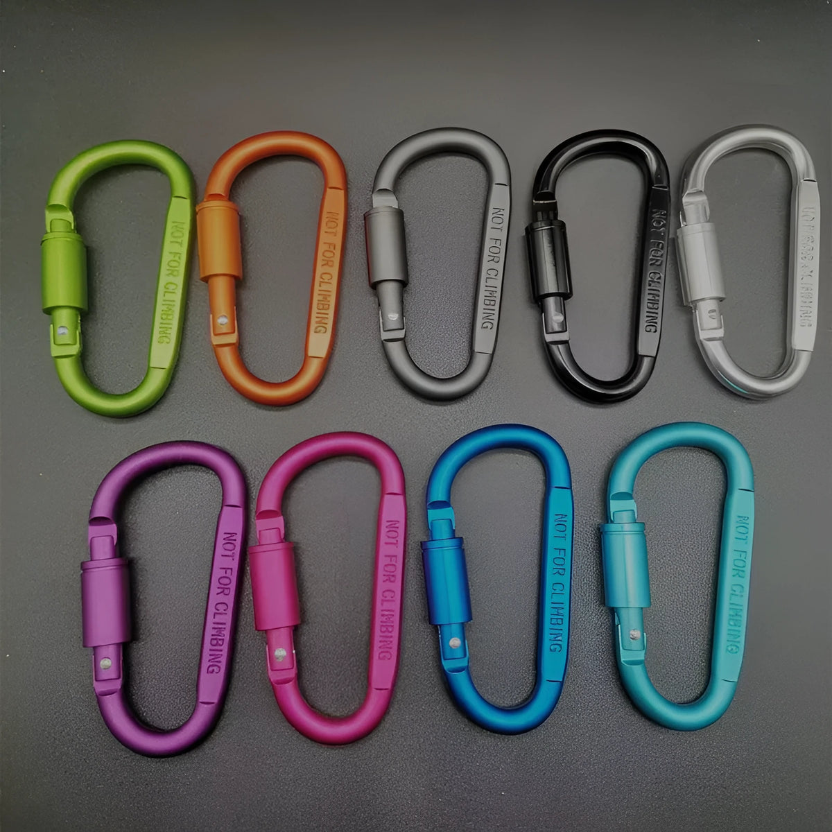 Aluminium D-shaped carabiner with lock shown in multiple colour options including black, silver, red, and blue.