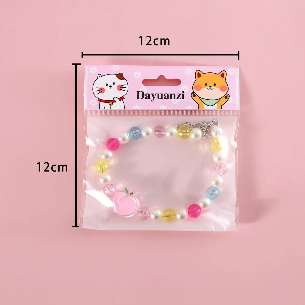 Colourful plastic pearl pet necklace with flower charm in rainbow, peach or small flower patterns
