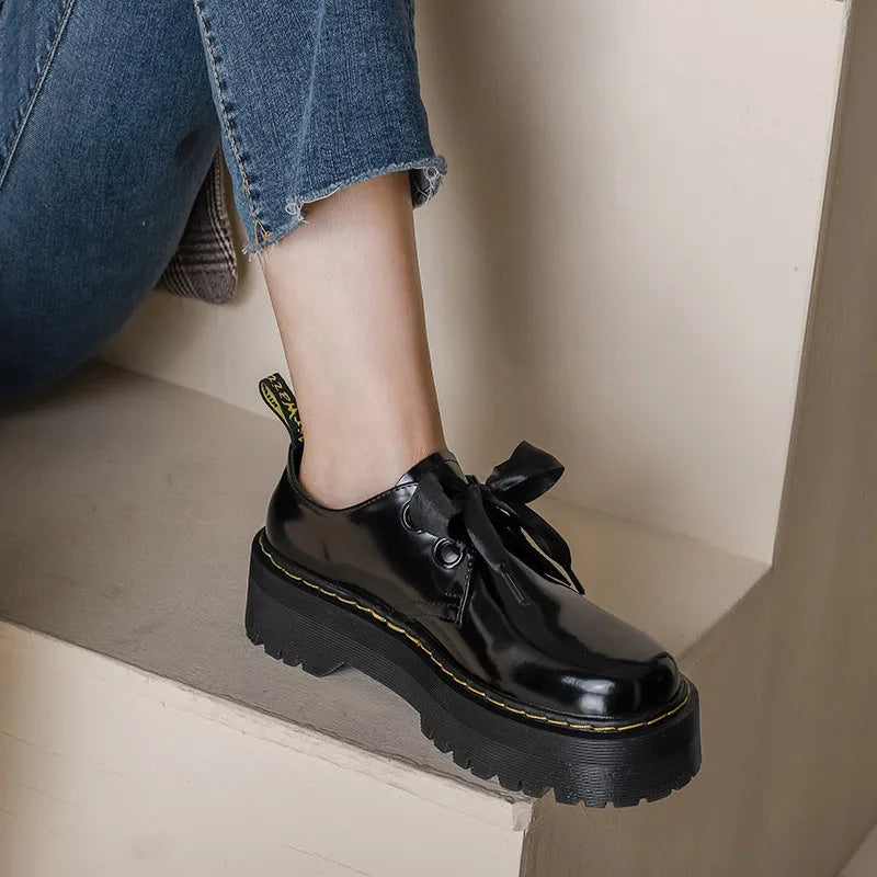 Women's black small leather shoes with thick TPR soles and cross strap design