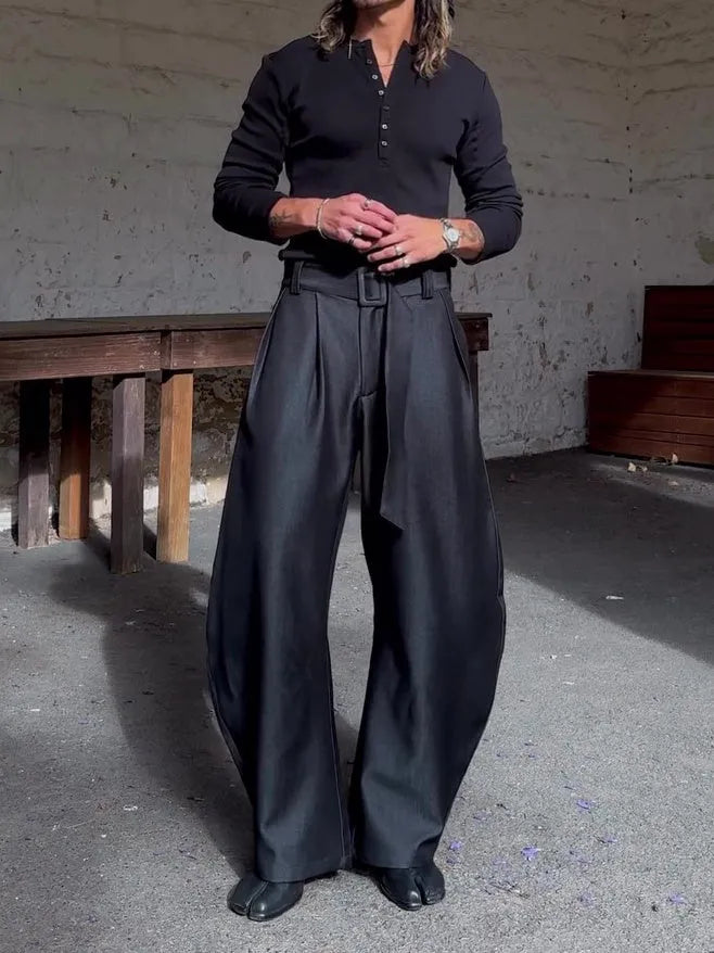 Chic black oversized wide-leg pants with high-waisted belt