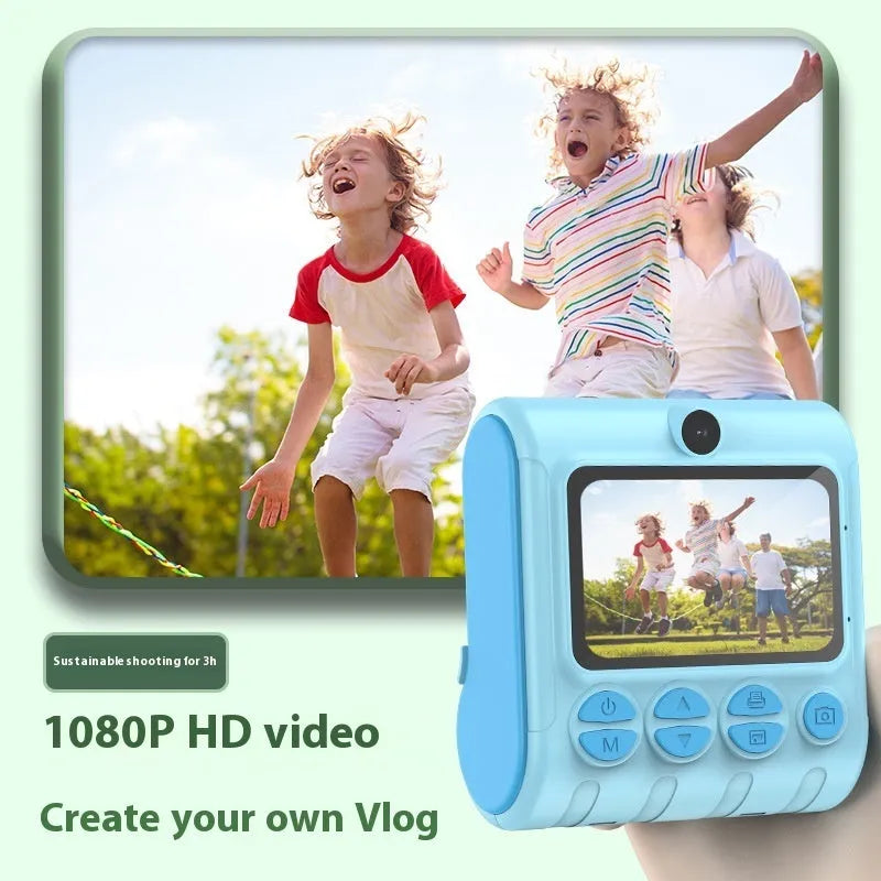 Children's instant printing camera with dual HD cameras in pink colour, showing included lanyard and printing paper