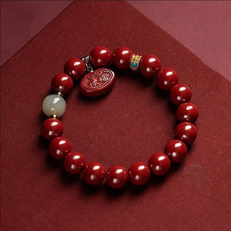 Red cinnabar bracelet with Ping An Fu Lu design in Emperor sandstone style showing 8mm and 10mm size options