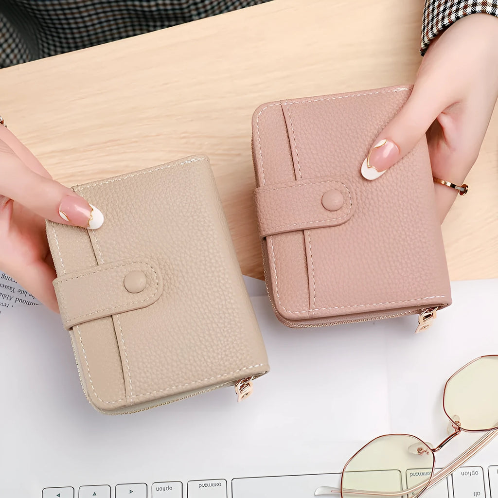 Women's solid colour short wallet with lychee pattern and sewing thread detail in multiple colours.