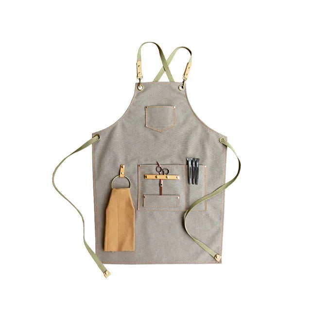 Canvas cross-strap apron in camel colour on hanger