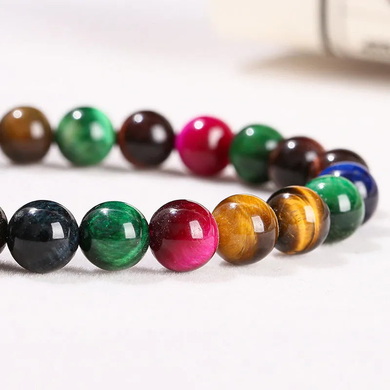 Colourful tiger-eye stone beaded bracelet with round beads on a cord, showing size options.