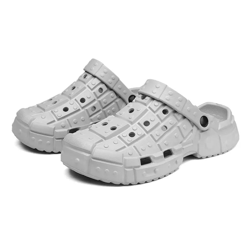 Men's sand-coloured EVA hole shoes with a thick non-slip sole and toe holder design on a plain background.