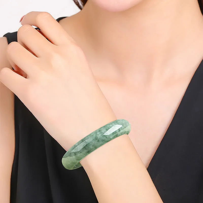 Natural emerald bean green jade beaded bracelet for women on a gift box.