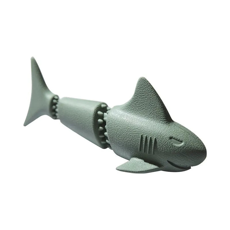 Blue shark-shaped rubber dog chew toy on a white background