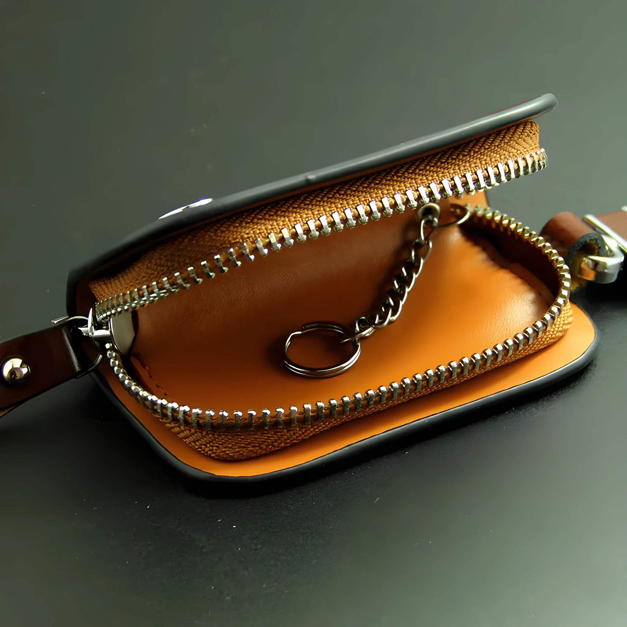 Genuine leather car key case in black or brown with frosted finish and 9.5cm by 4.5cm internal dimensions