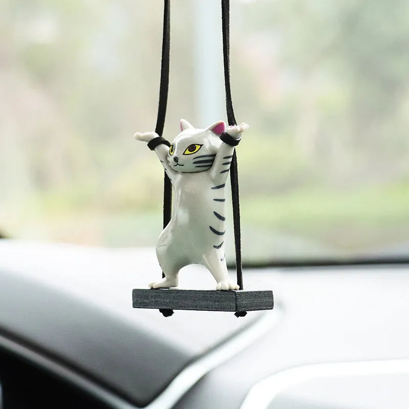 Resin cartoon cat pendant for car interior decoration with adjustable rope, shown in multiple colour options.