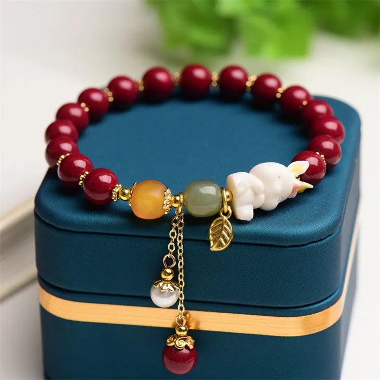 Tian Yu natural cinnabar bracelet with rabbit motif in traditional Chinese style