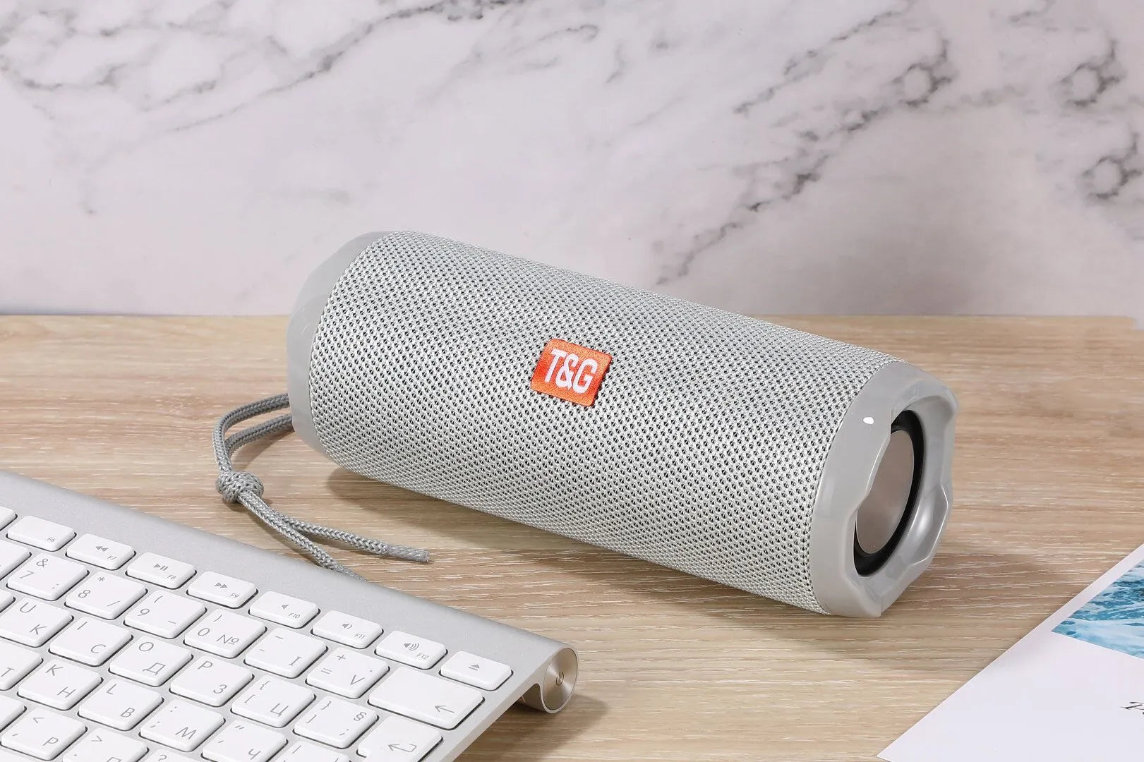 Fabric-covered portable Bluetooth speaker with card holder in multiple colour options