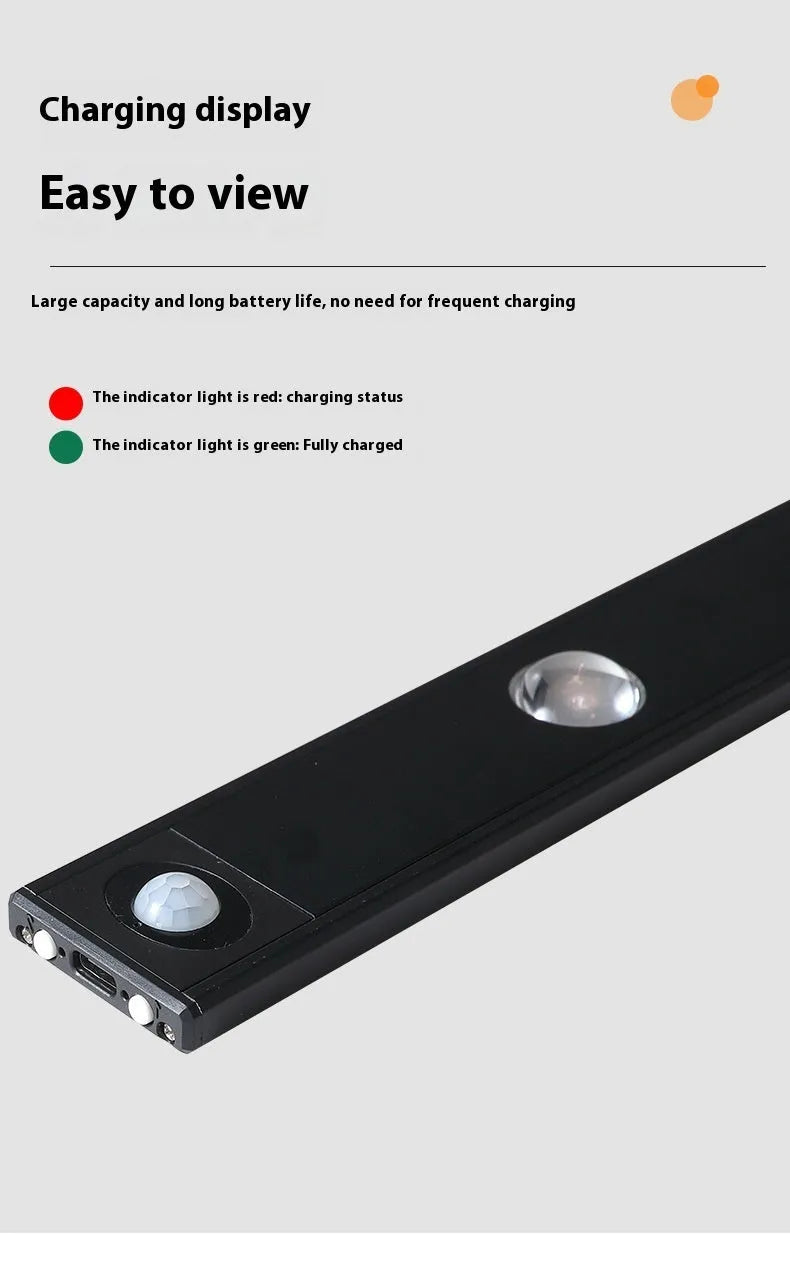 Black geometric cat's eye infrared sensor lamp with three colour light on a cabinet shelf