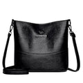 Women's casual soft leather bucket shoulder bag in black, wine red, or ginger yellow, showing large capacity and minimalist design.