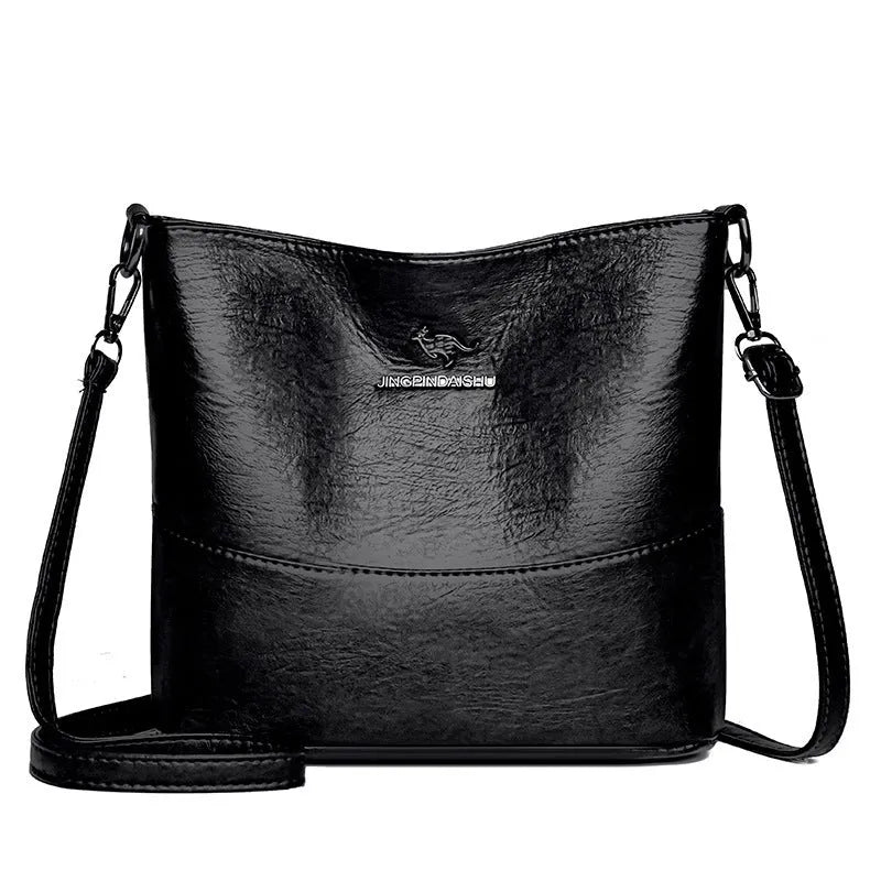 Women's casual soft leather bucket shoulder bag in black, wine red, or ginger yellow, showing large capacity and minimalist design.