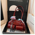 Retro style women's PU leather pillow-shaped flap handbag in black, shown with a double shoulder strap.