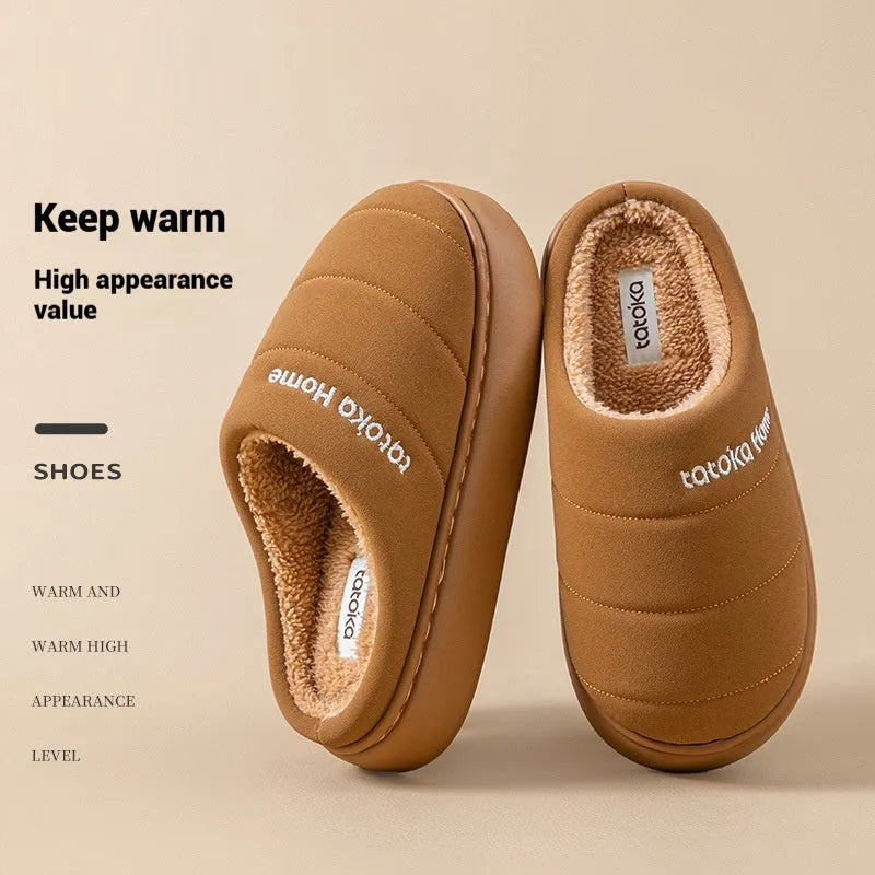Pair of khaki fleece-lined cotton slippers with round toe and flat platform sole